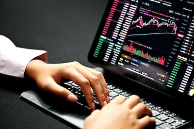 An image showcasing a trader analyzing complex candlestick charts on multiple screens, surrounded by stacks of financial reports, indicators, and mathematical equations, illustrating the intricacies of derivatives prop trading